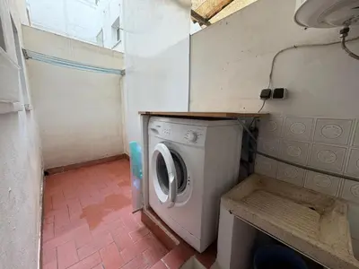 a small laundry room with a washing machine in it at Wimpy Solo Familias Serviplaya in Casas Las Basas