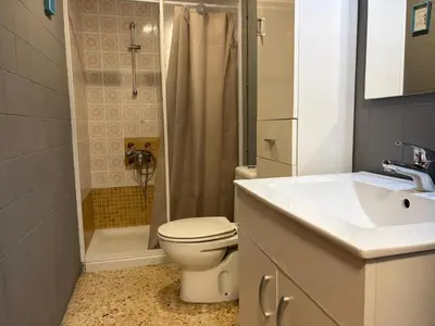a bathroom with a toilet and a sink and a shower at Wimpy Solo Familias Serviplaya in Casas Las Basas