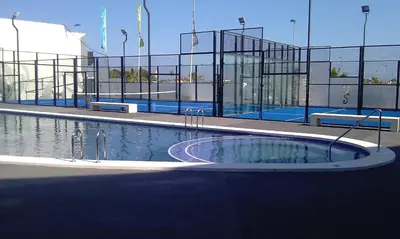 a large swimming pool in front of a building at playa in Almenara