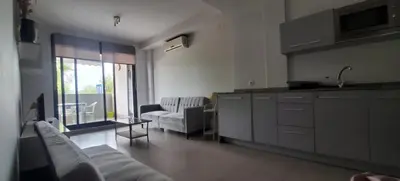 a kitchen and living room with a couch and a table at playa in Almenara