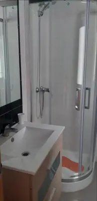 a bathroom with a shower and a white sink at playa in Almenara