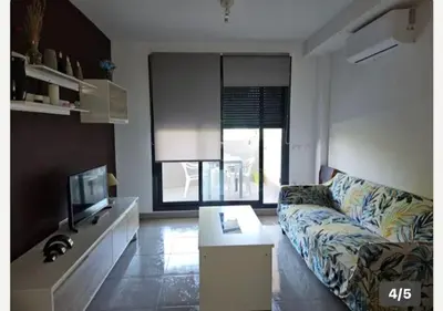 a living room with a couch and a tv at playa in Almenara