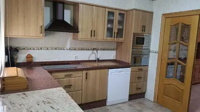 a kitchen with a sink and a dishwasher at La caseta del llorer in Catadau