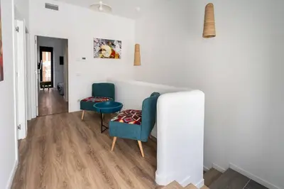a living room with two chairs and a couch at Maison avec piscine à Valencia in Valencia