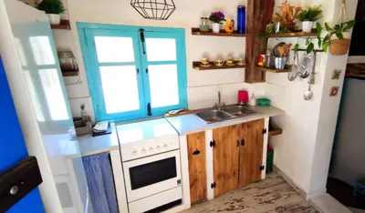 a small kitchen with a sink and a window at CasaJulis Chelva in Chelva