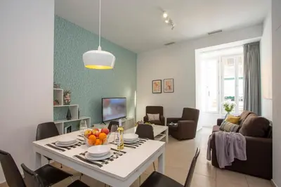 a living room with a table with fruit on it at SingularStays Mar44 in Valencia