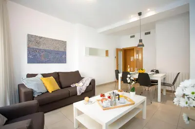 a living room with a couch and a table at SingularStays Mar44 in Valencia