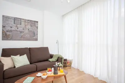 a living room with a couch and a table at SingularStays Mar44 in Valencia