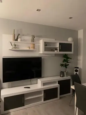 a living room with a large flat screen tv at Cosy and Modern Puerto de Sagunto Holiday Flat in Puerto de Sagunto