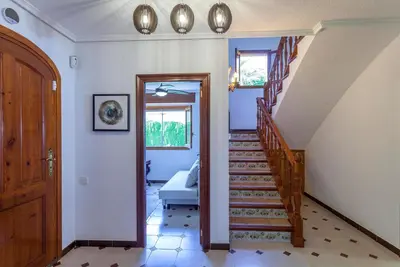 a hallway with a staircase in a house at VILLA LATEL in Serra