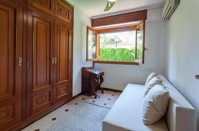 a living room with a couch and a window at VILLA LATEL in Serra