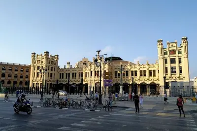a large building with bikes parked in front of it at PLAZA HOME ResEst in Valencia