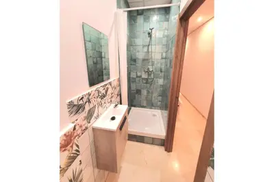 a bathroom with a tub and a sink and a shower at PLAZA HOME ResEst in Valencia