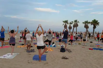 a group of people doing yoga on the beach at Tranquilidad a 2 minutos del mar in Canet de Berenguer