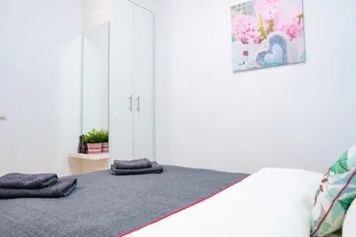 a bedroom with a bed with two pillows on it at Sollana Arena in Valencia