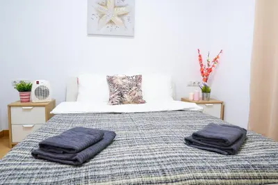 two towels are sitting on top of a bed at Sollana Arena in Valencia