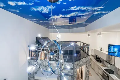 a room with a ferris wheel in the ceiling at Exquisite studio apartment with an original design in Valencia