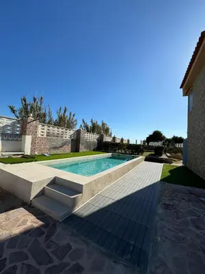 a swimming pool with a bench next to a house at Oasis en la playa: piscina y relax in Cullera