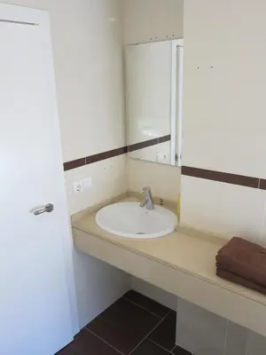 a bathroom with a sink and a mirror at Apartamentos Valencia in Valencia
