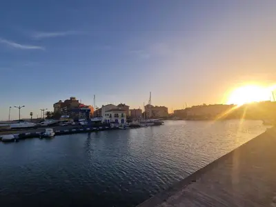a view of a river with the sun setting at Port Saplaya 1 Valencia in Port Saplaya
