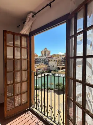 an open balcony with a view of a city at Port Saplaya 1 Valencia in Port Saplaya