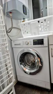 a washer and dryer in a room at Apartmán pri mori in El Brosquil
