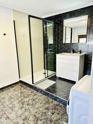 a bathroom with a shower and a sink at Playa Bonita Apartment in Puerto de Sagunto
