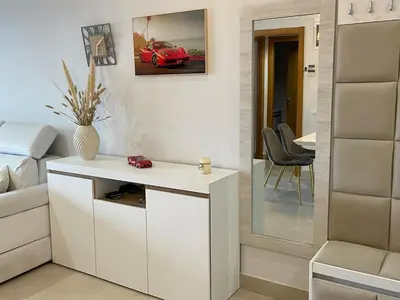 a bedroom with a bed and a table with a red car on the wall at Valencia Beach Home 23 in Valencia