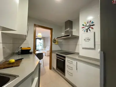 a kitchen with a sink and a stove top oven at Valencia Beach Home 23 in Valencia