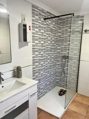 a bathroom with a sink and a shower at Villas de descanso in Vilamarxant