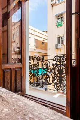 an open door with a view of a balcony at Casa Rosario Cabanyal flat near the beach, high end in Valencia