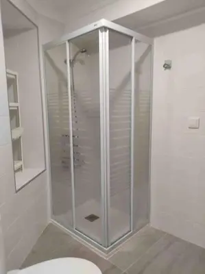 a glass shower in a bathroom with a toilet at Casa Coletor in Chulilla