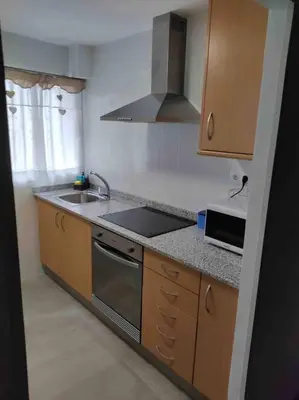a kitchen with a sink and a stove at Casa Coletor in Chulilla