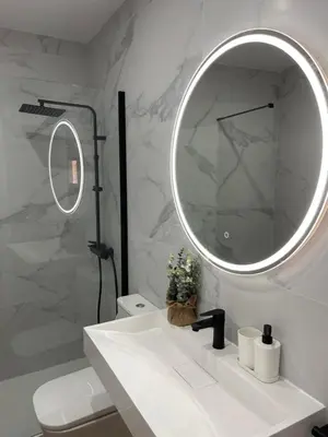 a bathroom with a white sink and a mirror at UIM Mediterraneo PB Virgen del Carmen Wifi in Puerto de Sagunto