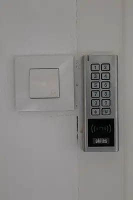 a remote control on a wall next to a switch at Cid 90 Flat by Concept in Valencia