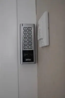 a remote control on the side of a refrigerator at Cid Flats by Concept in Valencia
