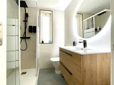 a bathroom with a sink and a toilet and a mirror at SPACIOUS, SUNNY FLAT BY CITY OF ARTS & SCIENCES in Valencia