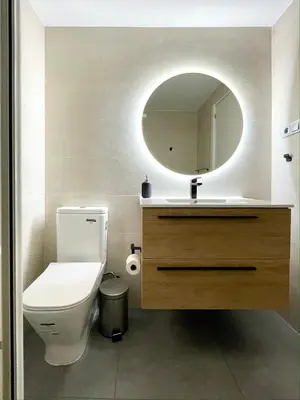 a bathroom with a white toilet and a mirror at SPACIOUS, SUNNY FLAT BY CITY OF ARTS & SCIENCES in Valencia
