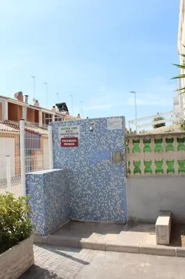 a building with blue tiles on the side of it at TBC The Beach Corner in Canet de Berenguer