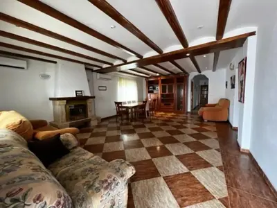 a living room with a couch and a fireplace at Casa Con Piscina Privada Marenyet in Cullera