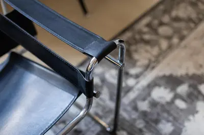 a book sitting on a chair in a room at BUBUFLATS Ayuntamiento in Valencia