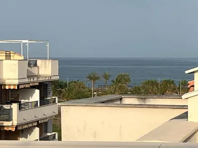 a view of the ocean from a building at PLAYA ALMENARA ATICO DUPLEX VISTAS AL MAR Y MONTAÑA WIFI,PISCINA a in Almenara