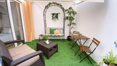 a balcony with a mirror and chairs and a table at Apartamento Teo in Russafa in Valencia