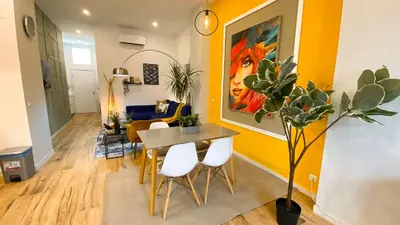 a living room with a table and chairs and a couch at Apartamento Teo in Russafa in Valencia