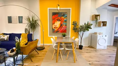 a living room with a table and a couch at Apartamento Teo in Russafa in Valencia