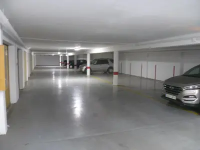 an empty parking garage with cars parked in it at Torremar, D-13-25 in Cullera