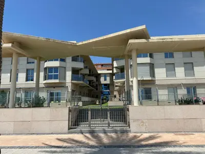 a large apartment building with a large building at Reinapart Patacona Beach 36 in Valencia