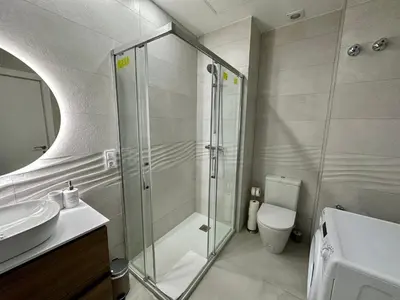 a bathroom with a shower and a sink and a toilet at Reinapart Patacona Beach 36 in Valencia