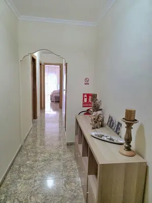 a hallway of a room with a counter and a hallway sidx sidx sidx at Vivienda Particular Cerca de Valencia in Paterna