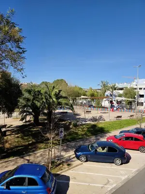 a group of cars parked in a parking lot at Vivienda Particular Cerca de Valencia in Paterna